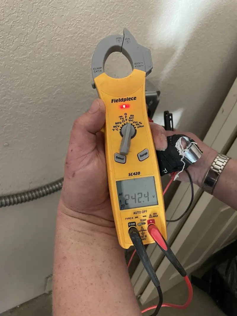 Voltage testing with clamp meter during Electrical Installation Services in Rifle